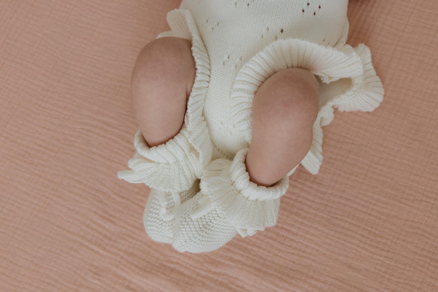 White pointelle ruffle romper